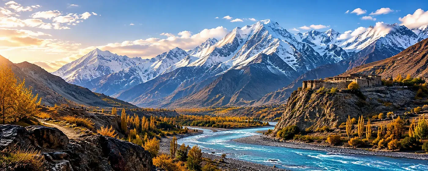 Sunrise over a fort on the bluff above the Chitral river in autumn