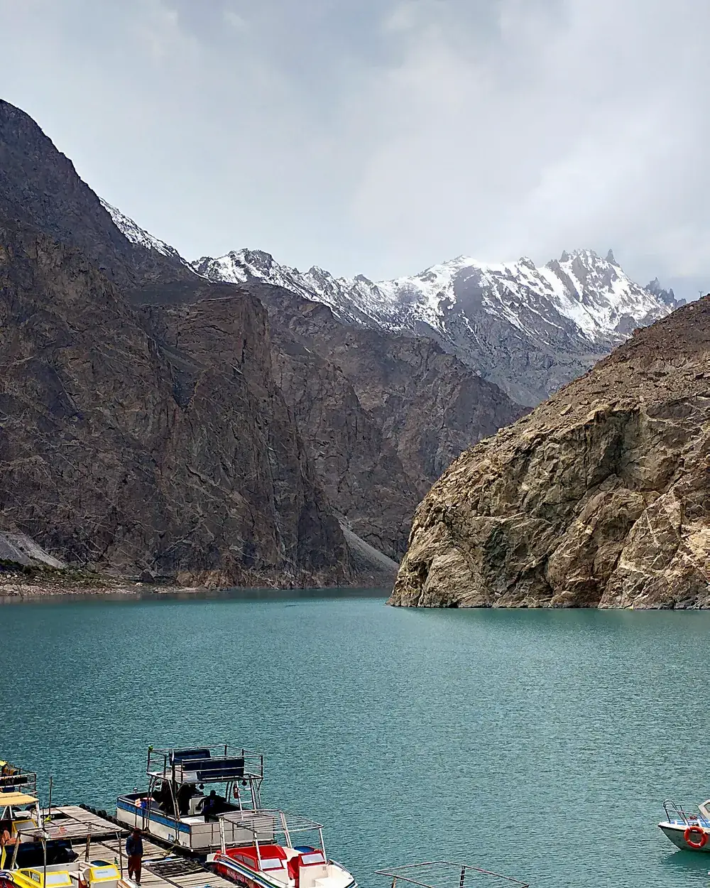 Boats on the turquoise water of Attabad