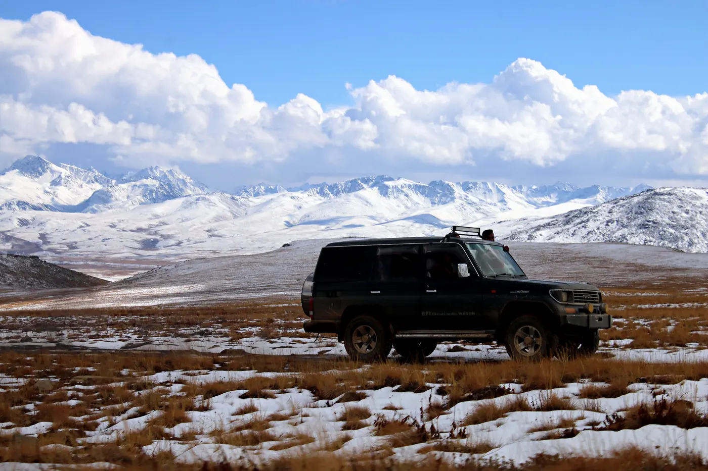 A jeep crossing the high plain of Deosai