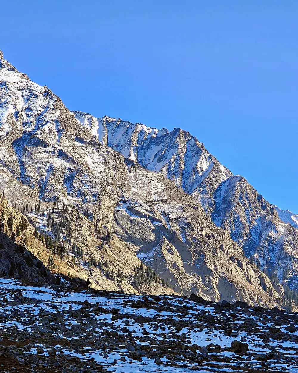 A snow peak above the riverbed at Kalam