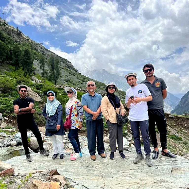 Our travellers together on a rocky pass